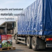 Truck covered with protective tarpaulin and laminated packaging bags used for industrial goods transport, showing durable tarpaulin and laminated packaging products
