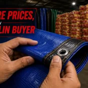Hands inspecting a heavy-duty HDPE tarpaulin roll from a trusted Tarpaulin Manufacturer before purchase.