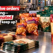 Laminated Pouch Manufacturer in India showcasing colourful printed pouches for namkeen, dry fruits, and sweets alongside stacked packaging films in a manufacturing facility